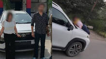 woman-catches-husband-eating-momos-with-girlfriend-he-drives-away-with-her-on-car-bonnet